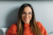 © Ivona Zivulj/Stocksy - Portrait of Pretty Young Woman With Glasses Sitting in Bed