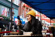 © Hernandez & Sorokina/Stocksy - Woman Using Mobile Phone At Restaurant Terrace