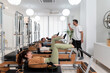 © Bisual Studio/Stocksy - Group doing abdominal curl exercise with straps