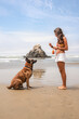© Luis Herrera/Stocksy - woman training her dog