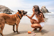© Luis Herrera/Stocksy - woman petting her dog