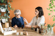 © Studio Serra/Stocksy - Naturopath And Patient Trying Essential Oils