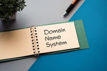 Poster - There is a notebook with the word Domain Name System. It is eye-catching image.