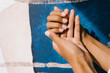 © Alina Hvostikova/Stocksy - Crop black female hands with natural manicure