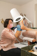 © Alina Hvostikova/Stocksy - Beautician doing procedure on clients feet