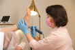 © Alina Hvostikova/Stocksy - Beautician doing procedure on clients feet