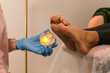 © Alina Hvostikova/Stocksy - Feet massage treatment with wax candle
