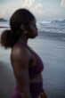 © Jovo Jovanovic/Stocksy - Blurry image of a woman at the beach