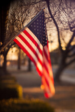 American Flag Hanging In Morning Light