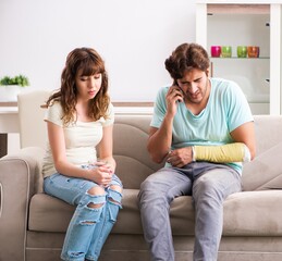 Wall Mural - Young family helping each other after injury