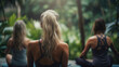 Girls making yoga in the lotus position. Tropical background 