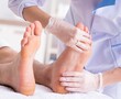 © Elnur - Podiatrist treating feet during procedure