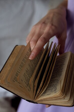 Closeup Of A Book And A Hand