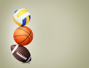 Wall Mural - Stack of different sport balls on beige background, space for text