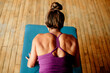 © Maria Manco/Stocksy - Overhead view of muscular woman doing yoga