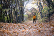 © Pixel Stories/Stocksy - Middle-aged woman walking/hiking in forest