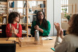 © Malquerida Studio/Stocksy - Office coworkers applauding in a meeting
