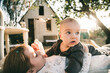 © Olga Murzaeva/Stocksy - children in the yard