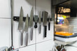 © Diego Martin/Stocksy - View of knives on a wall
