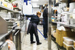 © Diego Martin/Stocksy - Asian woman wiping in kitchen restaurant