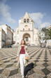 © Lupe Rodríguez/Stocksy - mature caucasian woman walking through a square in the city