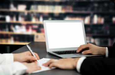 Poster - Empty laptop computer screen for astute design mockup on a table in library of university