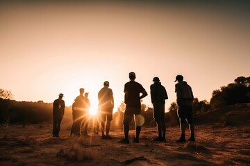 Wall Mural - A Group Of People Standing On Top Of A Dirt Field At Sunset Desert Travel Photography Group Travel Generative AI 