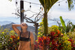 © Raymond Forbes LLC/Stocksy - Happy woman relaxing and bathing refreshing outdoor shower landscape