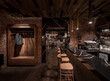 © Andriy Bezuglov/Stocksy - Illuminated restaurant in loft style with shabby brick walls