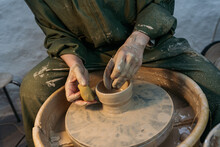 Potter working at pottery wheel