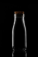 Poster - Empty milk Bottle on black background 