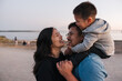 © Rob and Julia Campbell/Stocksy - Family of three enjoying time together outside on walking path.