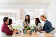 © Santi Nuñez/Stocksy - Colleagues women using laptop