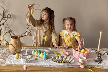 Children Hang Easter Eggs