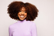 © VICTOR TORRES/Stocksy - Smiling black woman with curly hair