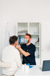 © Studio Firma/Stocksy - Doctor Examining Senior Man