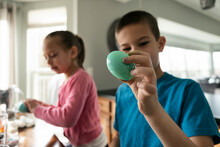 Children Coloring Easter Eggs At Home