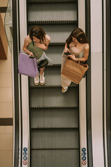 Wall Mural - Two girls on their phones