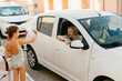© Jimena Roquero/Stocksy - Kid and dog waving goodby to grandparents leaving in white car