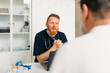 © Studio Firma/Stocksy - Doctor Examining Senior Man
