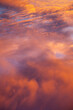 © Sonja Lekovic/Stocksy - dramatic orange clouds in the purple sky at sunset