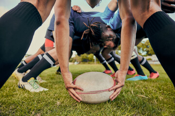 Canvas Print - Sport, rugby ball and team on field, men playing game with energy and fitness with huddle together. Teamwork, scrum and ready for professional match, male sports club and outdoor with exercise