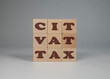 Podatek VAT, CIT. Drewniane klocki z napisem podatek WAT, CIT.
