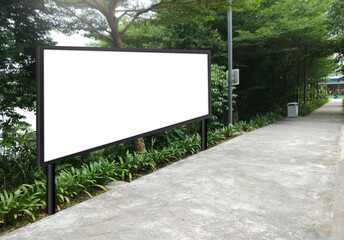 Wall Mural - Large horizontal blank advertising poster billboard mockup, framed by trees and plants, lush surrounding. Digital light box display screen for OOH media. Out of home template beside pedestrian path