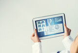 Fototapeta  - Close of female doctor hands working with tablet pc computer