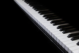 Fototapeta  - Piano and Piano keyboard with black background.