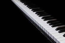Piano And Piano Keyboard With Black Background.