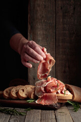 Wall Mural - The hand of a prosciutto thief.