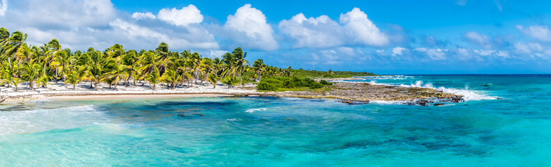 Wall Mural - A view across the sandy beach at the mexican resort of Costa Maya on the Yucatan peninsula on a sunny day