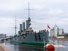 ST. PETERSBURG, RUSSIA, March10, 2020: The Cruiser Aurora. The Ship Is Moored At Petrogradskaya Embankment And Is A Museum. On The Nose Set Naval Flag Of Russia